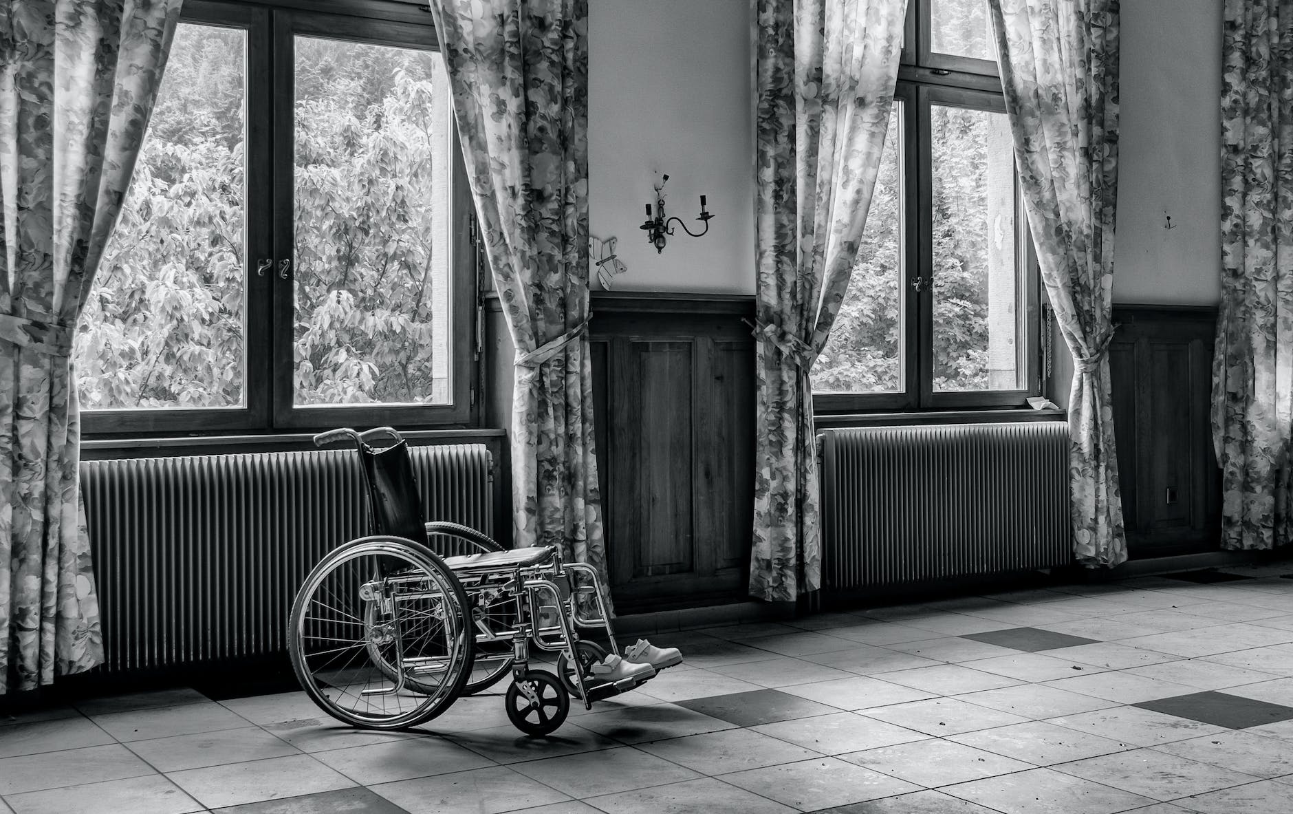 grayscale photo of wheelchair